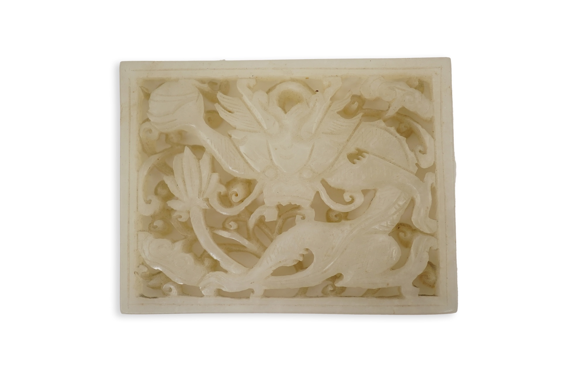 A Chinese reticulated white jade ‘dragon’ plaque, 18th century